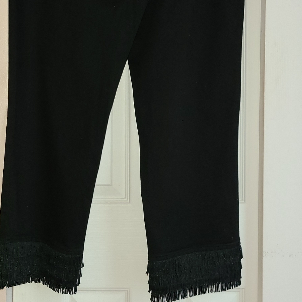 Inc black jeans with  back & front pockets & fringe trim at the bottom.